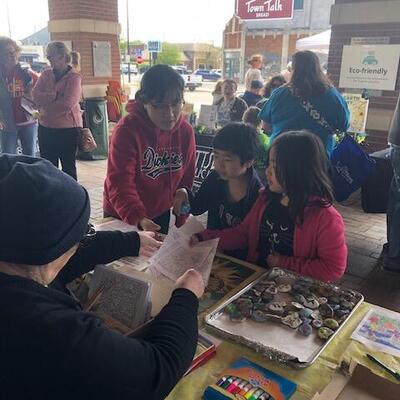 Evelyn Williamson teaching about Monarchs at Earth Day